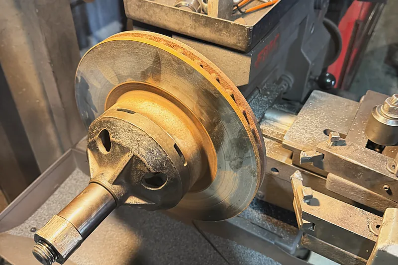 A brake rotor being machined on the brake lathe
