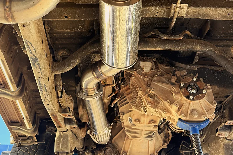 Gearbox and transfer case from underneath a 4WD on the hoist